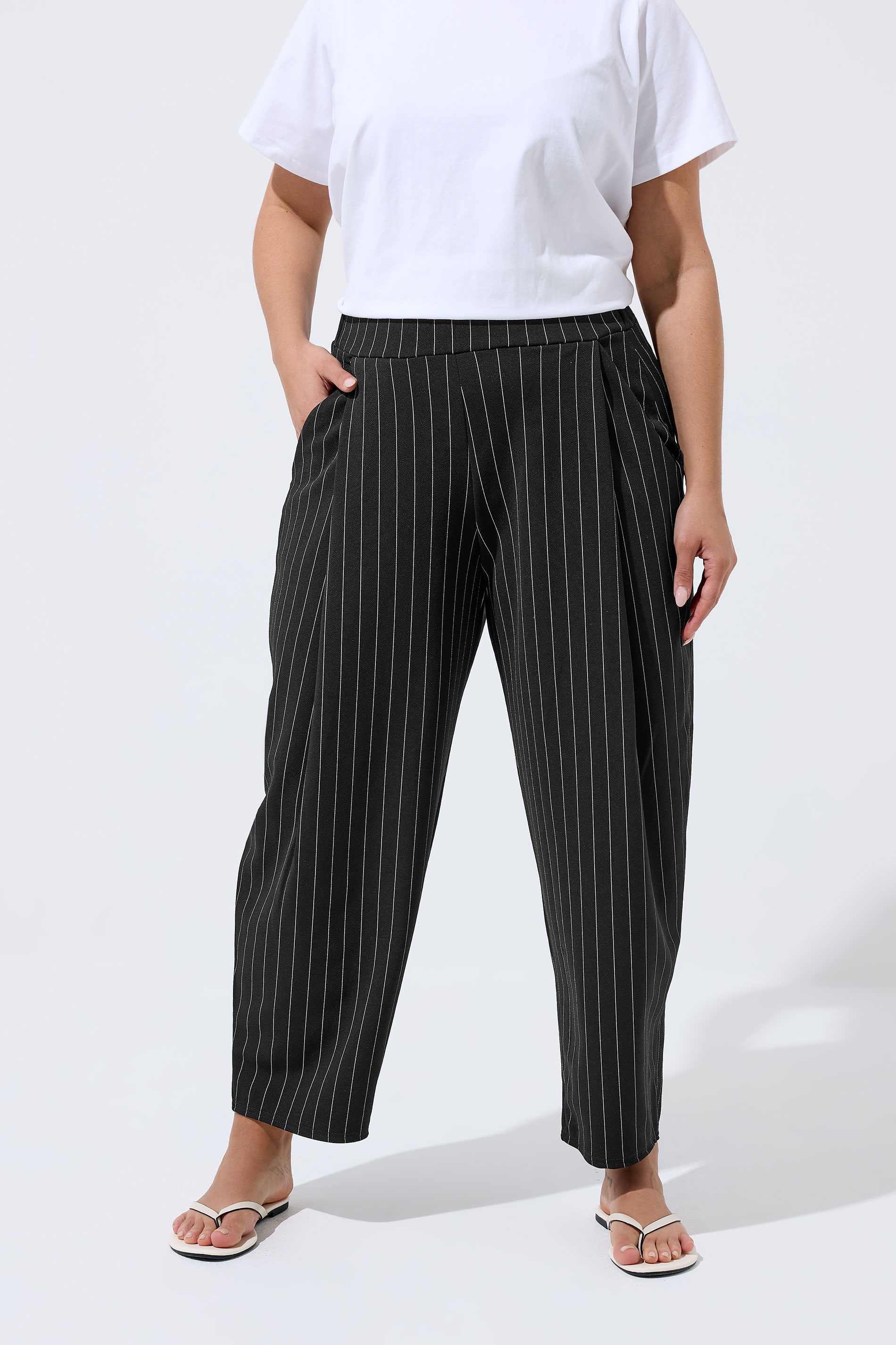 LIMITED COLLECTION Plus Size Black Pinstripe Barrel Trousers | Yours Clothing 1