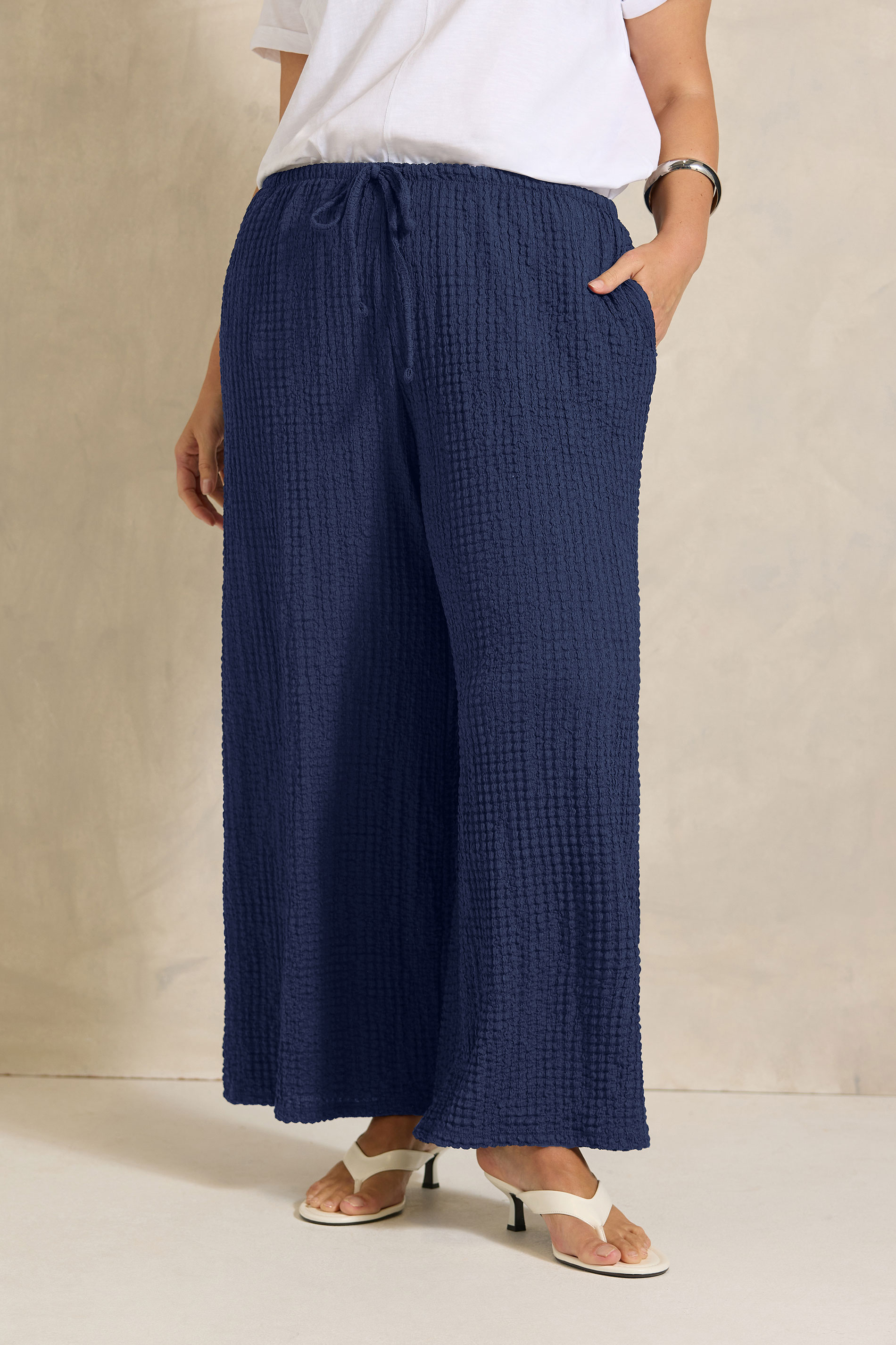 EVANS Plus Size Navy Blue Crinkle Wide Leg Trousers | Evans 1