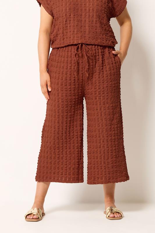 YOURS Plus Size Rust Orange Bubble Textured Cropped Trousers | Yours Clothing 1
