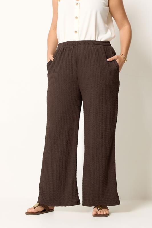 YOURS Plus Size Chocolate Brown Bubble Textured Wide Leg Trousers | Yours Clothing 1