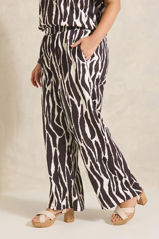 EVANS Plus Size Chocolate Brown Zebra Print Wide Leg Trouser | Evans 1