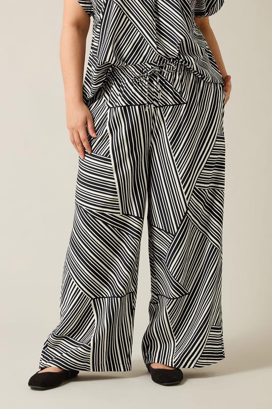 EVANS Plus Size Black Stripe Print Wide Leg Trousers | Evans 2