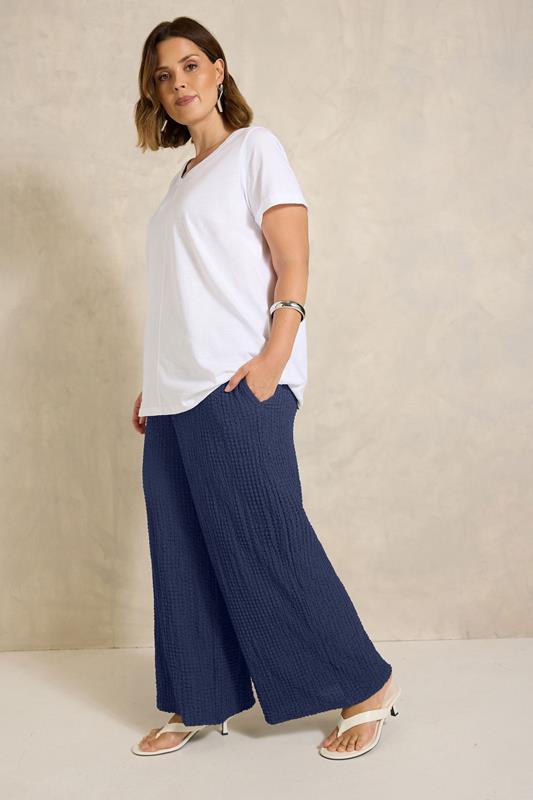 EVANS Plus Size Navy Blue Crinkle Wide Leg Trousers | Evans 1