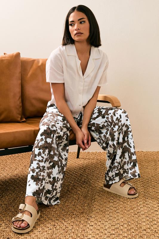 PixieGirl Petite Women's Brown Cow Print Wide Leg Trousers | PixieGirl 1