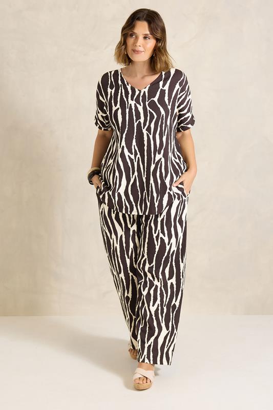 EVANS Plus Size Chocolate Brown Zebra Print V-Neck Top | Evans 1