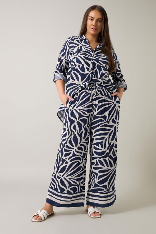 EVANS Plus Size Navy Blue Palm Border Print Trousers | Evans 2