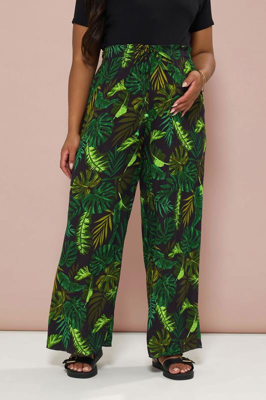 BUMP IT UP MATERNITY Plus Size Black & Green Palm Print Trousers | Yours Clothing 1
