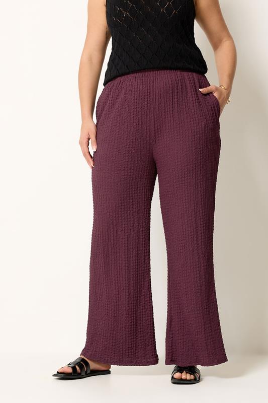 YOURS Plus Size Burgundy Red Bubble Textured Trousers | Yours Clothing 1