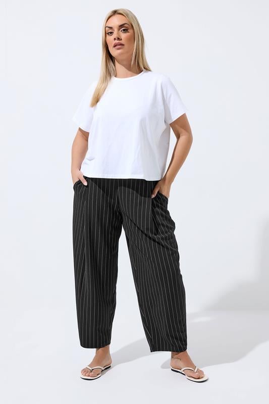 LIMITED COLLECTION Plus Size Black Pinstripe Barrel Trousers | Yours Clothing 1