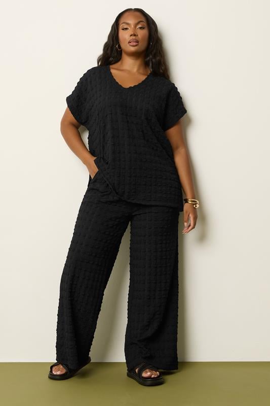 YOURS Plus Size Black Bubble Textured Wide Leg Trousers | Yours Clothing 1