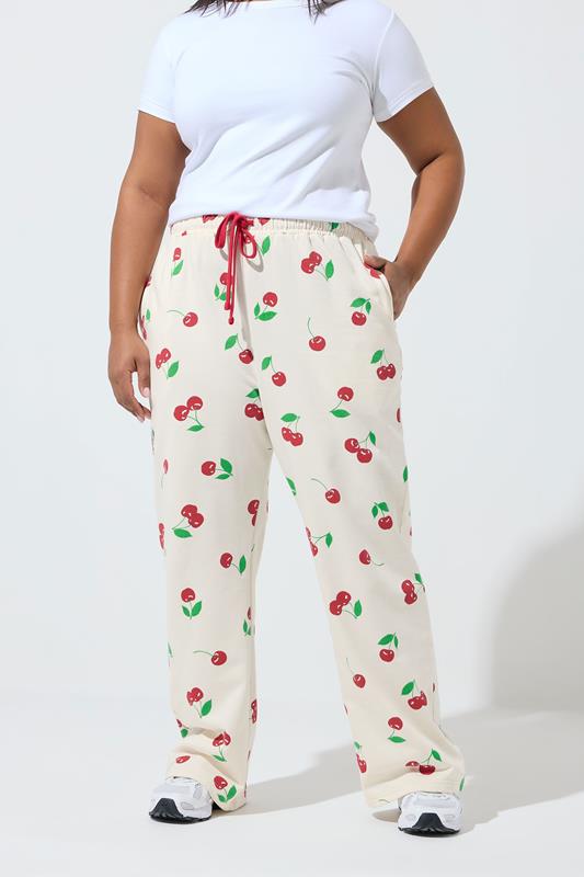 LIMITED COLLECTION Plus Size Cream Cherry Straight Leg Joggers | Yours Clothing 1