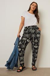 YOURS Plus Size Black Palm Print Balloon Trousers | Yours Clothing 1