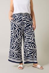 EVANS Plus Size Navy Blue Palm Border Print Trousers | Evans 1
