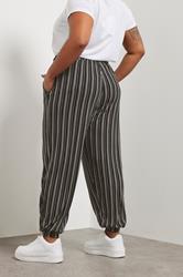 YOURS Plus Size Black Striped Jersey Cuffed Trousers | Yours Clothing 4
