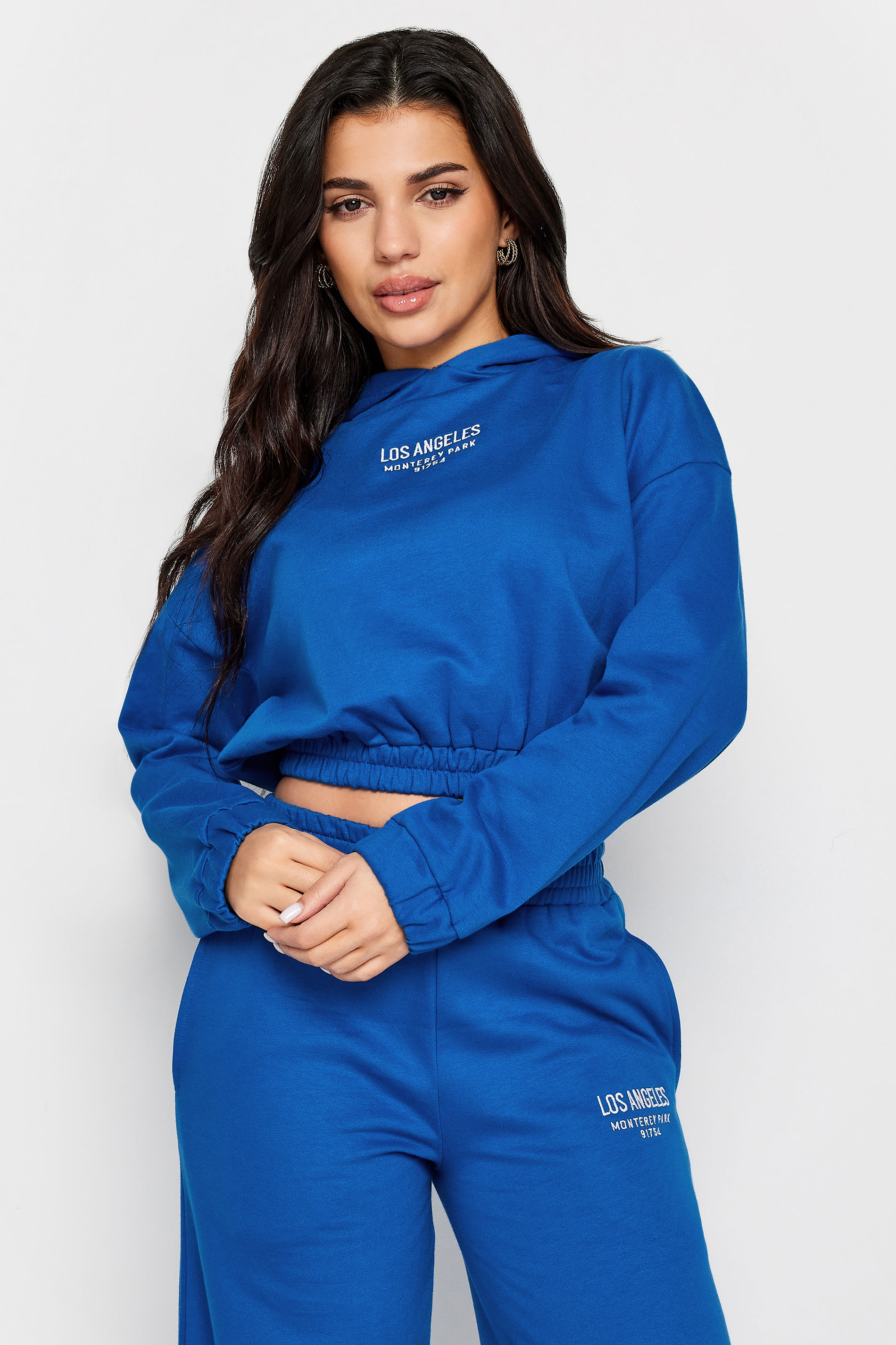 PixieGirl Petite Womens Cobalt Blue 'Los Angeles' Slogan Cotton Cropped Hoodie | PixieGirl  1