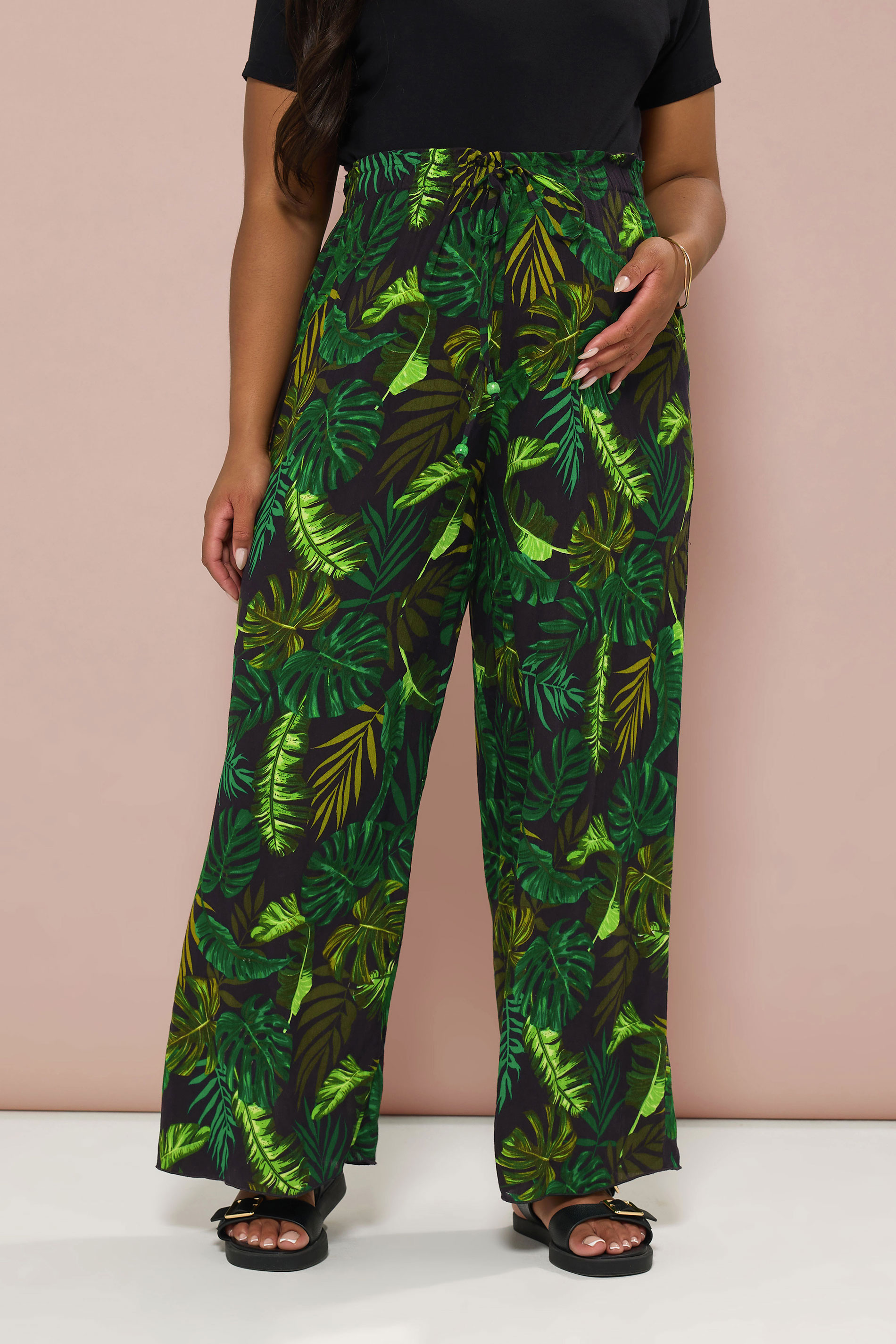 BUMP IT UP MATERNITY Plus Size Black & Green Palm Print Trousers | Yours Clothing 1