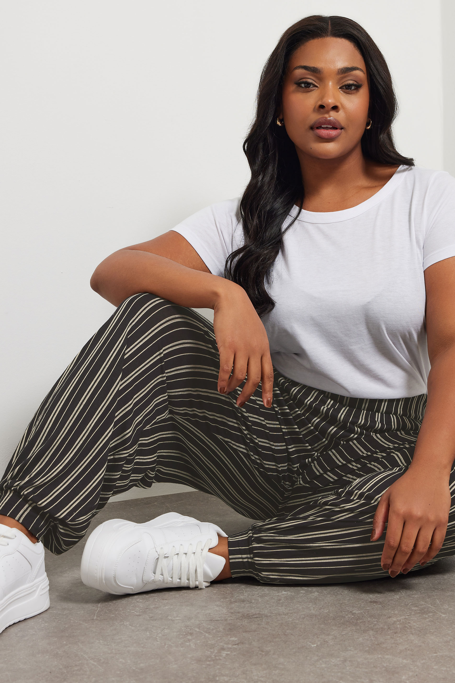 YOURS Plus Size Black Striped Jersey Cuffed Trousers | Yours Clothing 1
