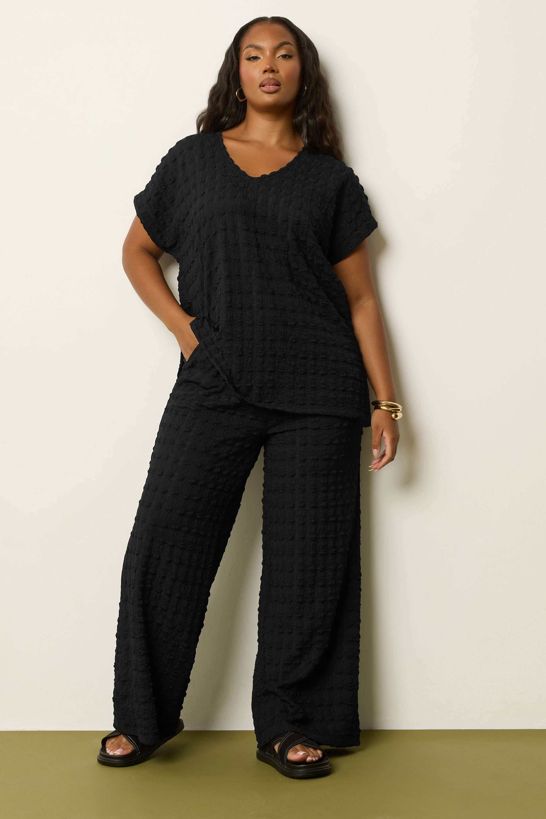 YOURS Plus Size Black Bubble Textured Wide Leg Trousers | Yours Clothing 1