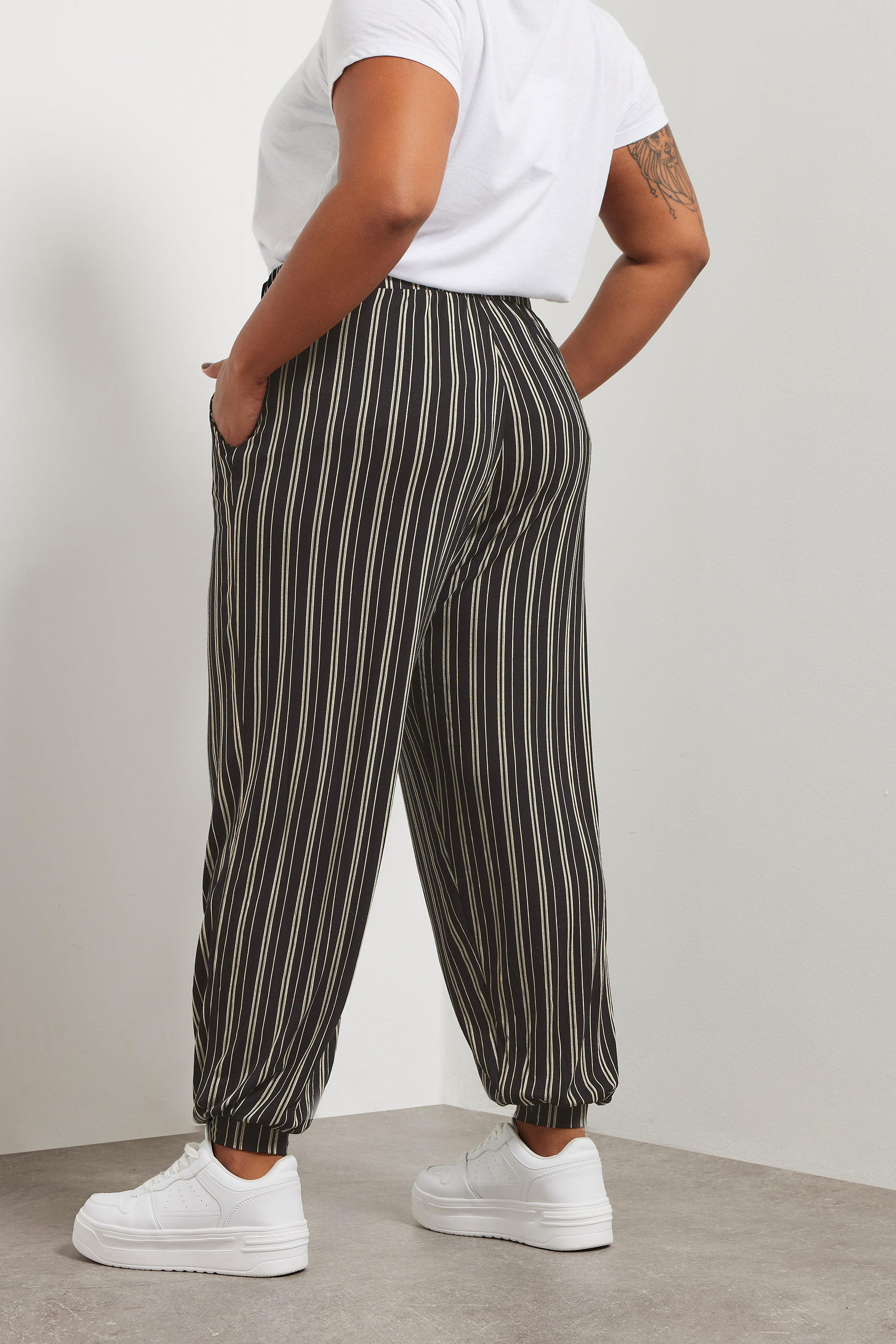 YOURS Plus Size Black Striped Jersey Cuffed Trousers | Yours Clothing 4